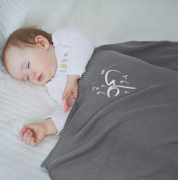 A beautifully knitted personalised baby blanket, crafted for pure comfort and finished with elegant Arabic name embroidery.