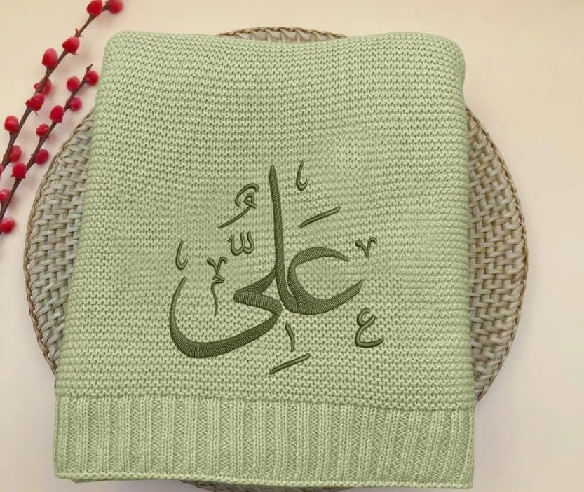 A beautifully knitted personalised baby blanket, crafted for pure comfort and finished with elegant Arabic name embroidery.